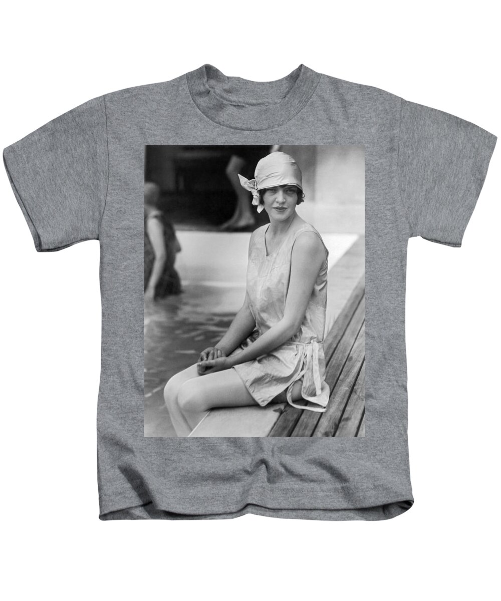 1 Person Kids T-Shirt featuring the photograph Young Woman Sitting By Pool by Underwood Archives