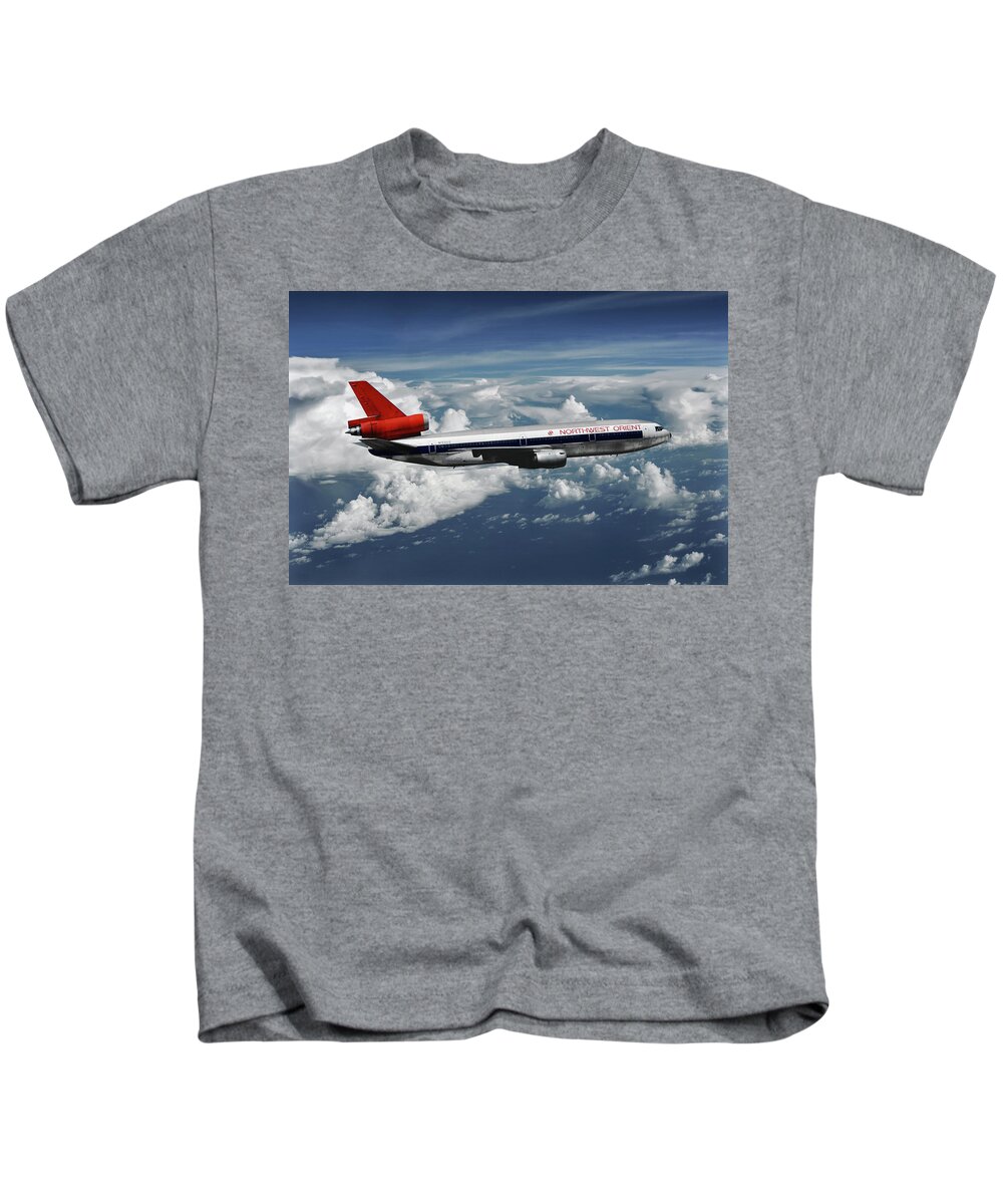 Northwest Orient Airlines Kids T-Shirt featuring the mixed media Among the Clouds - Northwest Orient DC-10-40 by Erik Simonsen