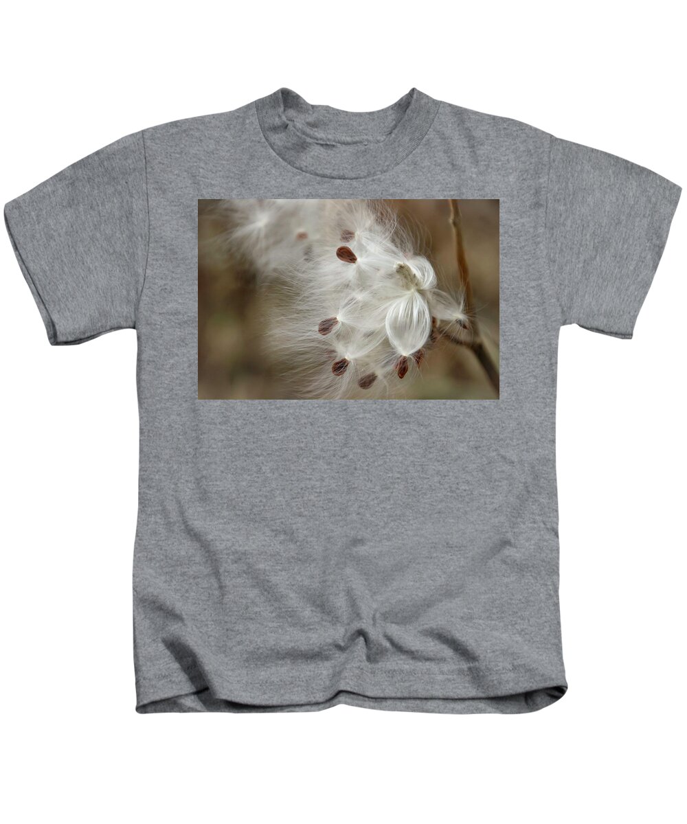 Milkweed Kids T-Shirt featuring the photograph Milkweed Spreading Seeds by Laura Smith