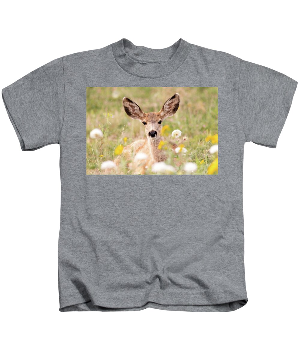 Deer Kids T-Shirt featuring the photograph Mule Deer Fawn Lying in Wildflowers by Tony Hake