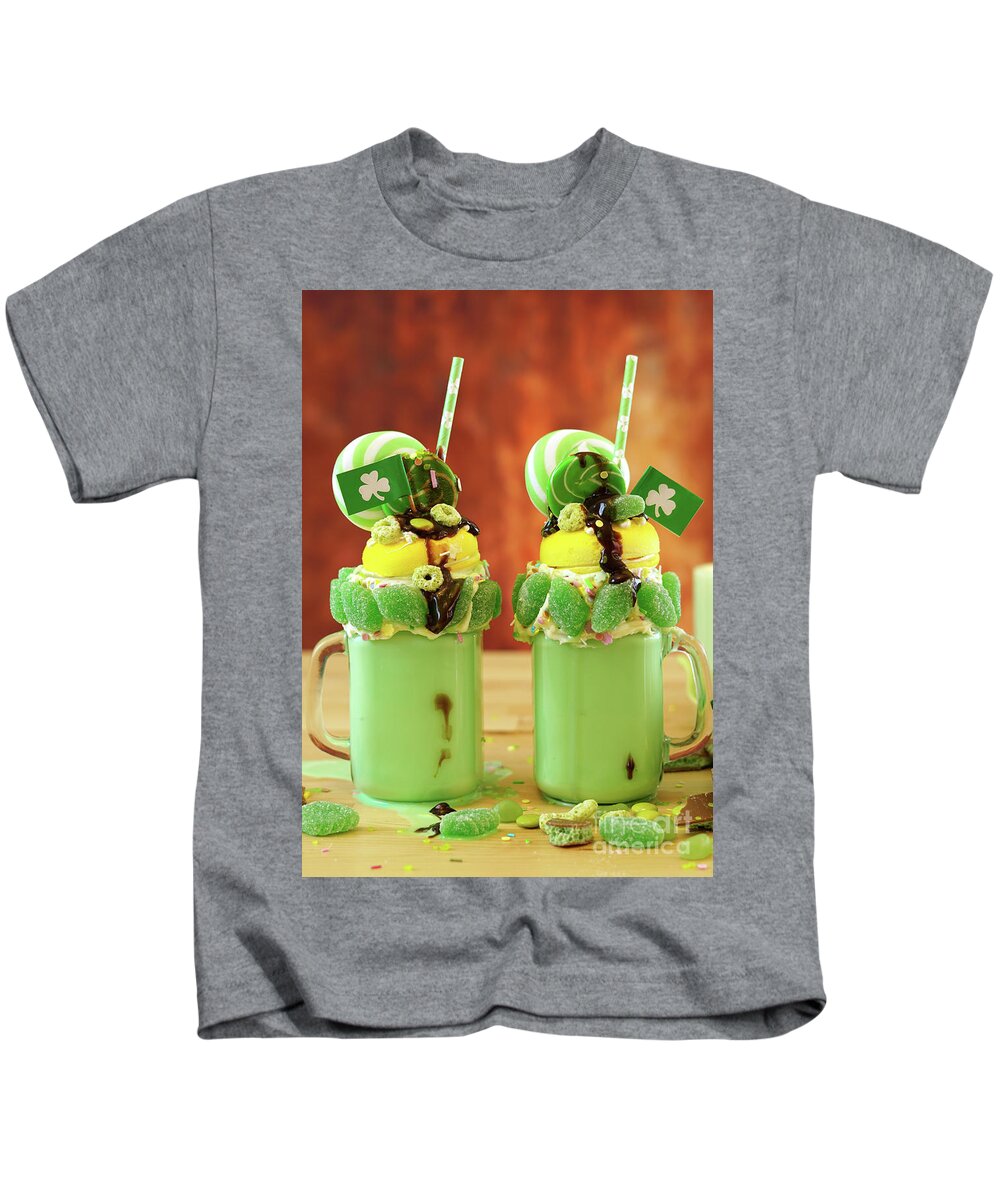 St Patricks Day Kids T-Shirt featuring the photograph St Patrick's Day on-trend holiday freak shakes with candy and lollipops. by Milleflore Images