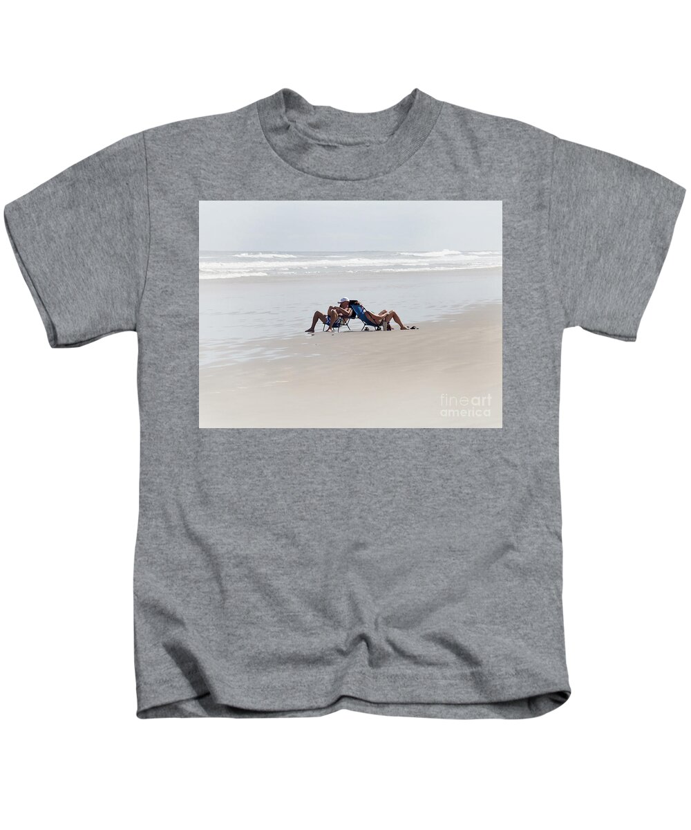 Couple Kids T-Shirt featuring the photograph A Couples Beach Moment by Neala McCarten
