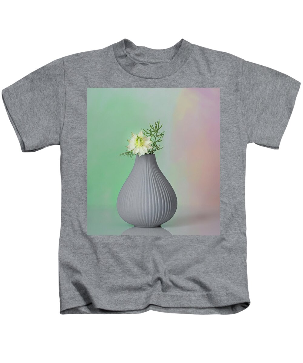 Love In A Mist Kids T-Shirt featuring the photograph A Love in a Mist in its vase by Sylvia Goldkranz