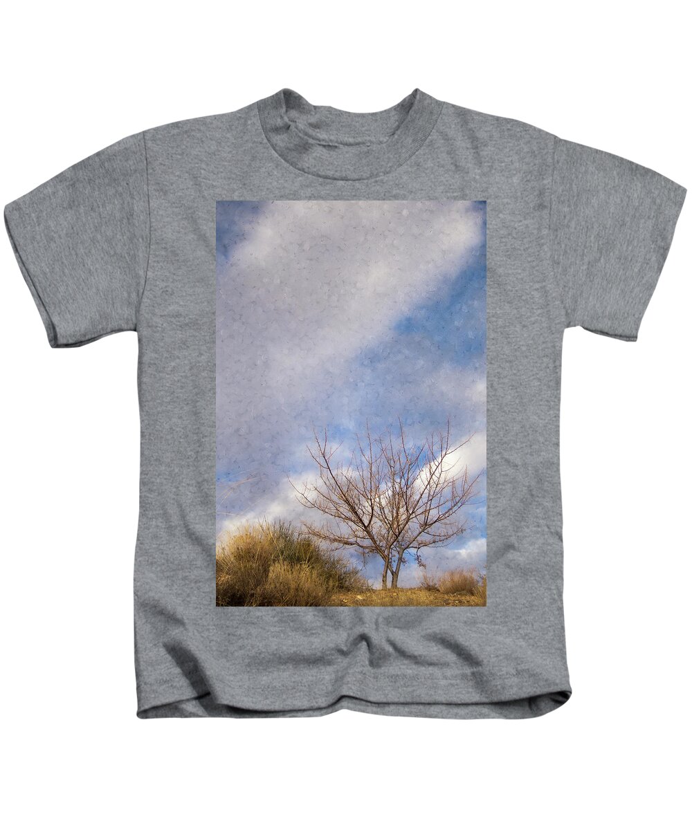 Scenic Kids T-Shirt featuring the photograph Chamisa and Tree and Clouds Perched on a Hill by Mary Lee Dereske