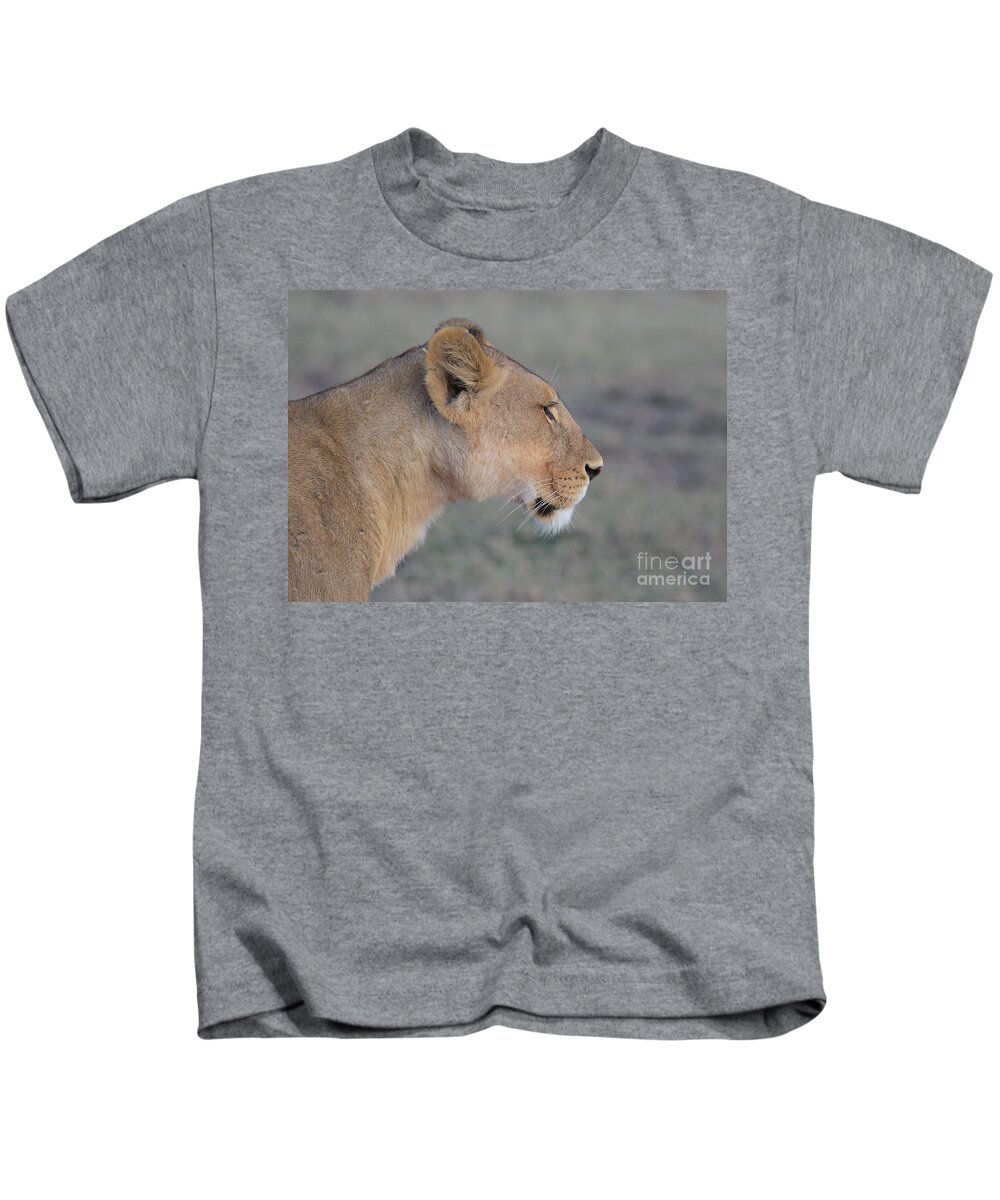 Lioness Kids T-Shirt featuring the photograph Close-up And Side Portrait Of Lioness In The Wild In The Wild Masai Mara Kenya by Nirav Shah