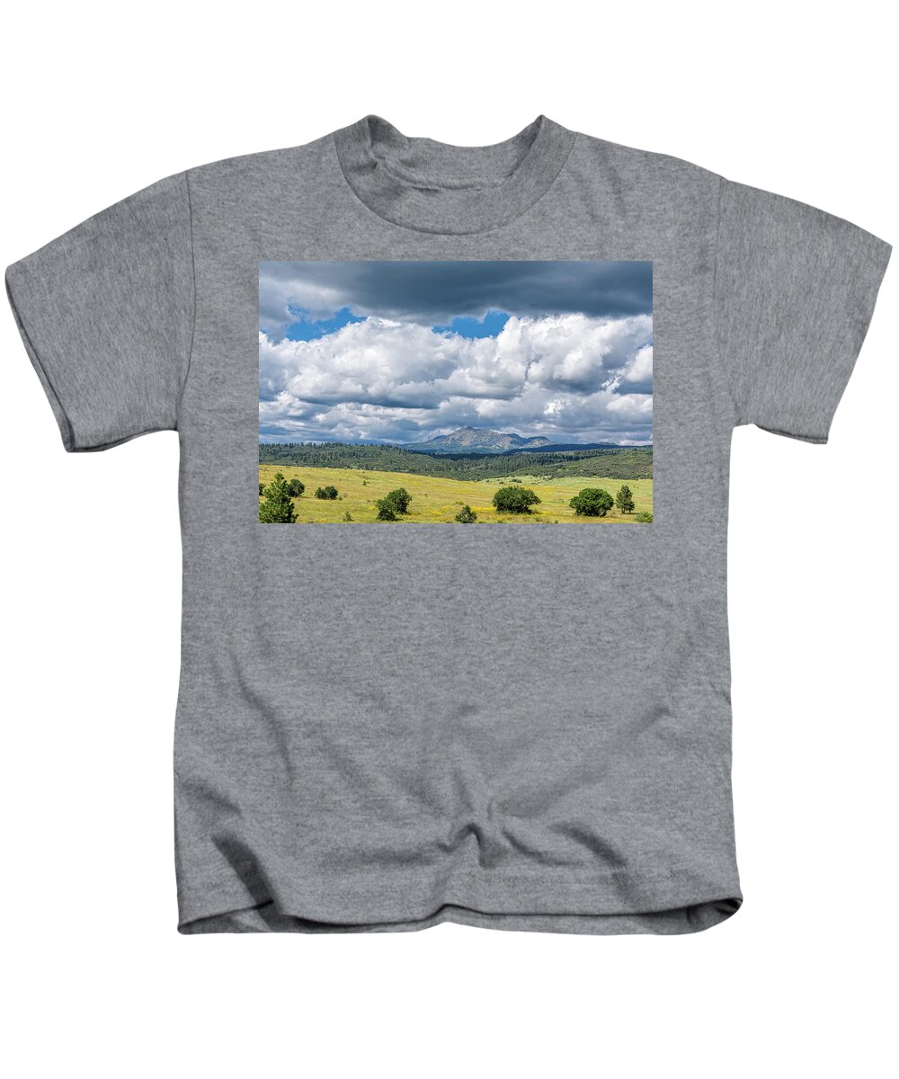 Chama Kids T-Shirt featuring the photograph Clouds Build Over Landscape of Chama New Mexico by Debra Martz