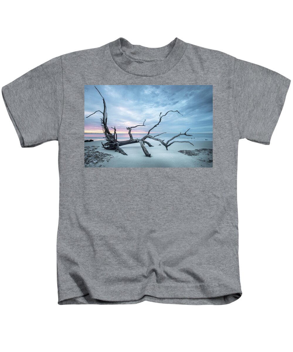 Driftwood Beach Kids T-Shirt featuring the photograph Beach Driftwood Footprints Jekyll Island Georgia Sunrise by Jordan Hill