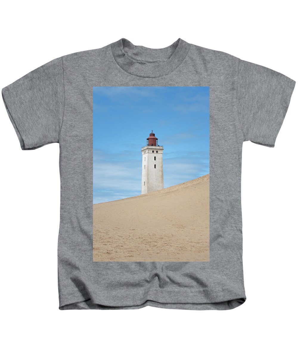 Rubjerg Kids T-Shirt featuring the photograph Rubjerg Knude Fyr Lighthouse by Anges Van der Logt