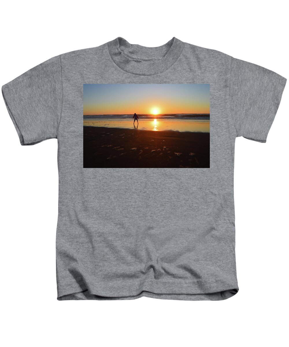 Beach Sunset Kids T-Shirt featuring the photograph Sun Dance Kid by Susie Loechler
