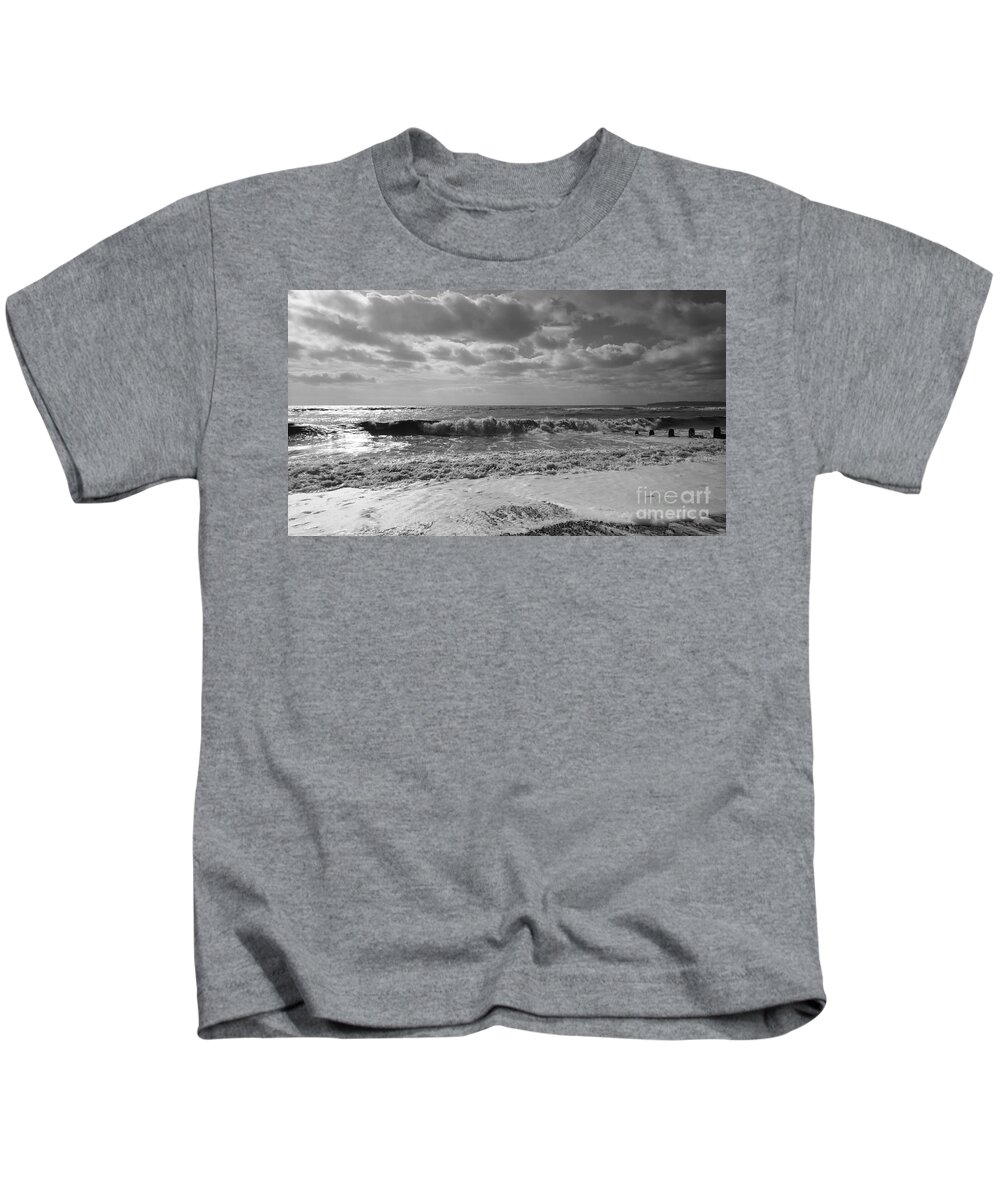 Sea Kids T-Shirt featuring the photograph Windy seaside, waves and clouds, Camber Sands, monochrome by Paul Boizot