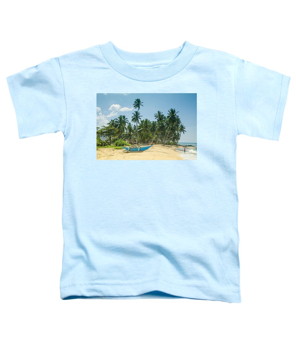 Catamaran Toddler T-Shirt featuring the photograph Blue Catamaran at a beach with coconut palm trees by Gina Koch