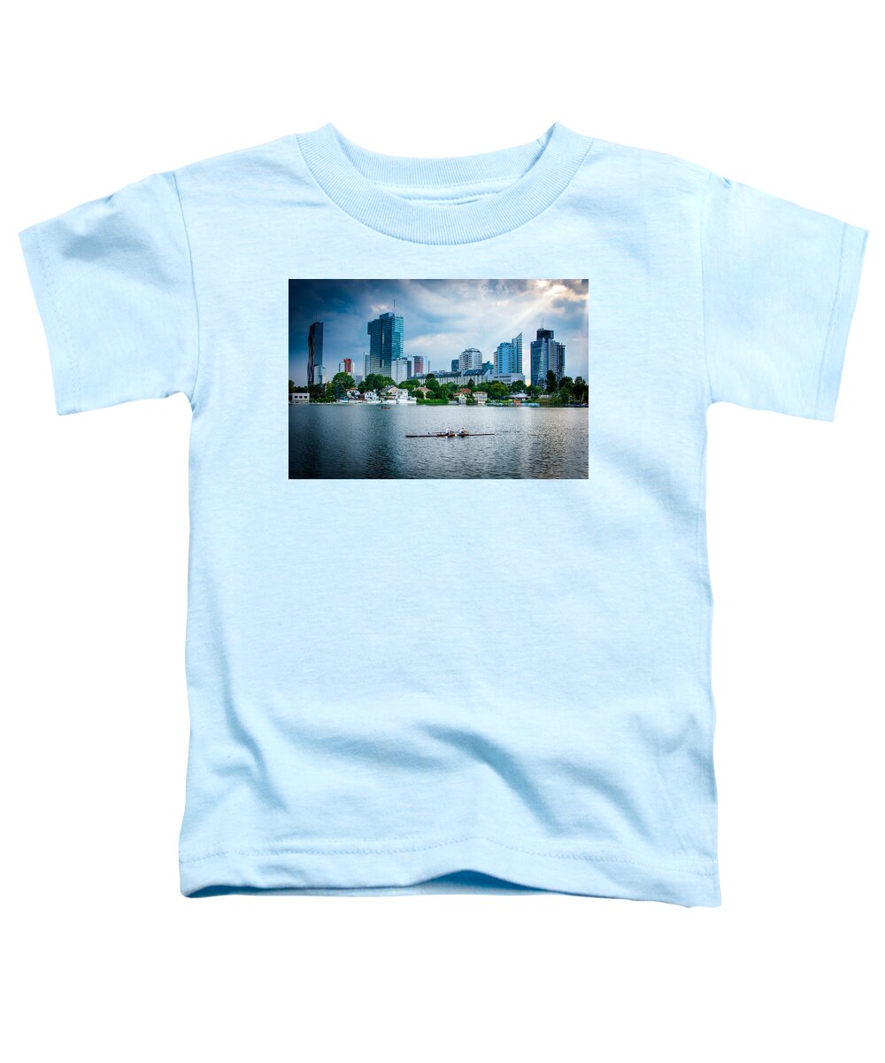 Skyline Toddler T-Shirt featuring the photograph Rowing Boat And The Skyline Of Vienna by Andreas Berthold