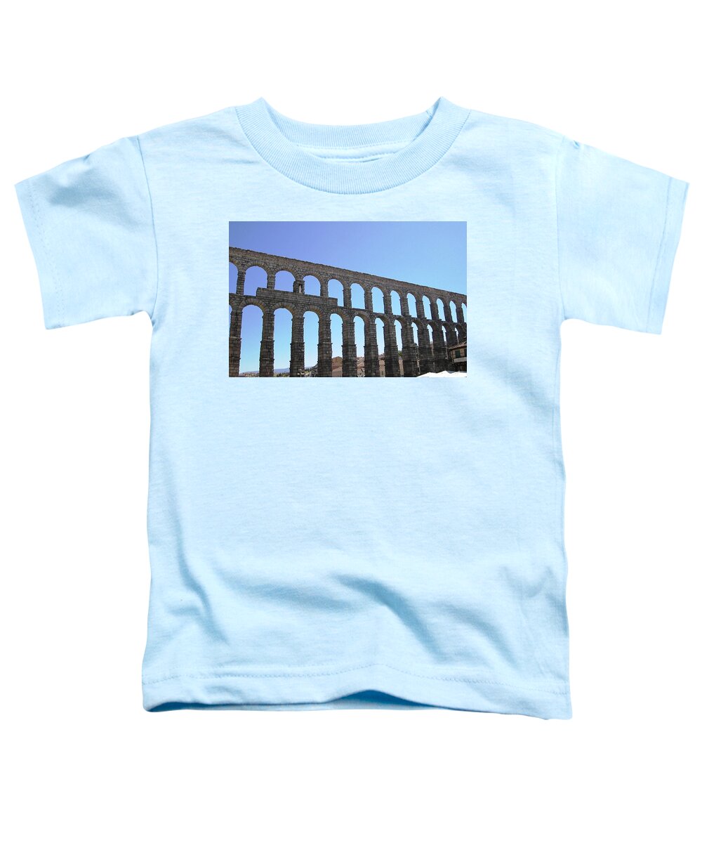 Segovia Toddler T-Shirt featuring the photograph Segovia Ancient Roman Aqueduct Architectural Granite Stone Structure IX With Arches in Sky Spain by John Shiron