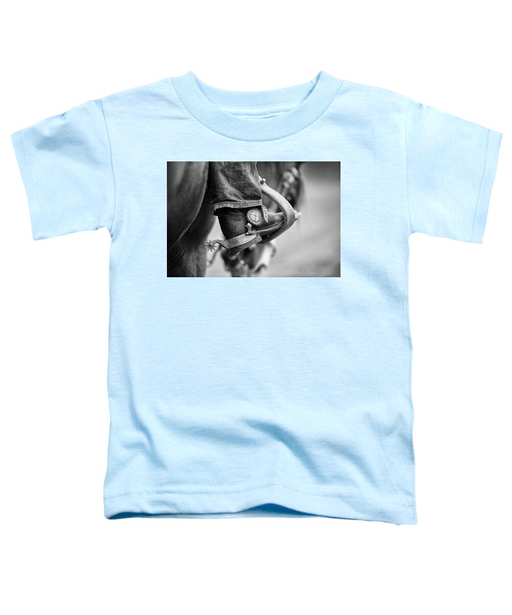 Three Bars Ranch Toddler T-Shirt featuring the photograph I've Got Spurs - Three Bars Ranch by Ryan Courson