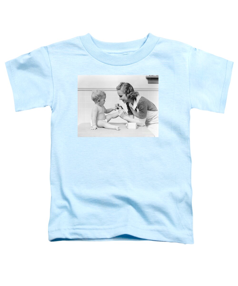 1930s Toddler T-Shirt featuring the photograph Mother Reciting This Little Piggy by H. Armstrong Roberts/ClassicStock