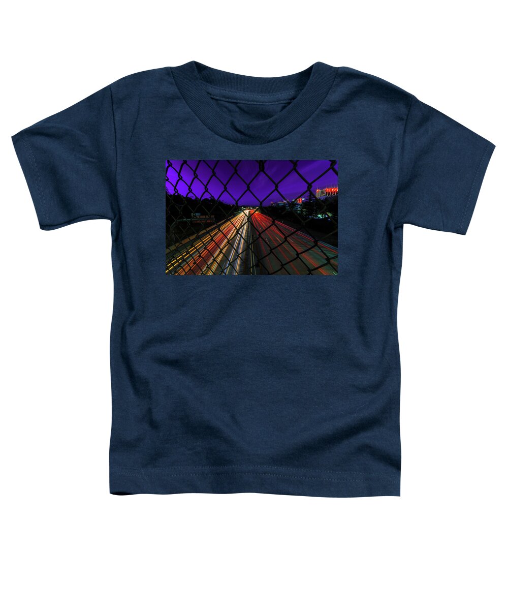 Purple Toddler T-Shirt featuring the photograph Light Trails of Vehicles on I-80 on A Summer Night In Downtown Reno Under a Purple Sky by Brian Ball