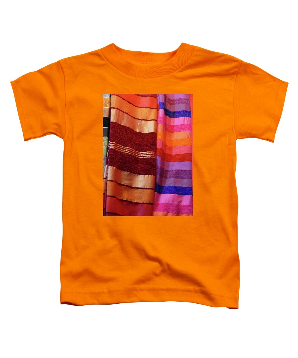 Marrakech Toddler T-Shirt featuring the photograph Colorful fabrics in the medina market by Steve Estvanik