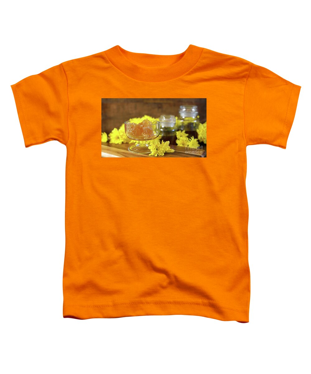 Honey Toddler T-Shirt featuring the photograph Raw honeycomb with liquid honey in glass jar with lavendar. #1 by Milleflore Images