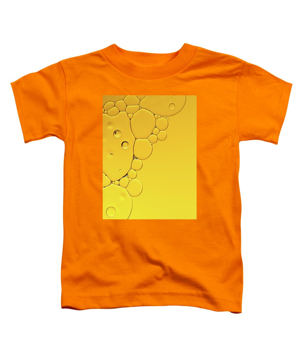 Fluid Toddler T-Shirt featuring the photograph Abstract, image of oil, water and soap with colourful background by Michalakis Ppalis