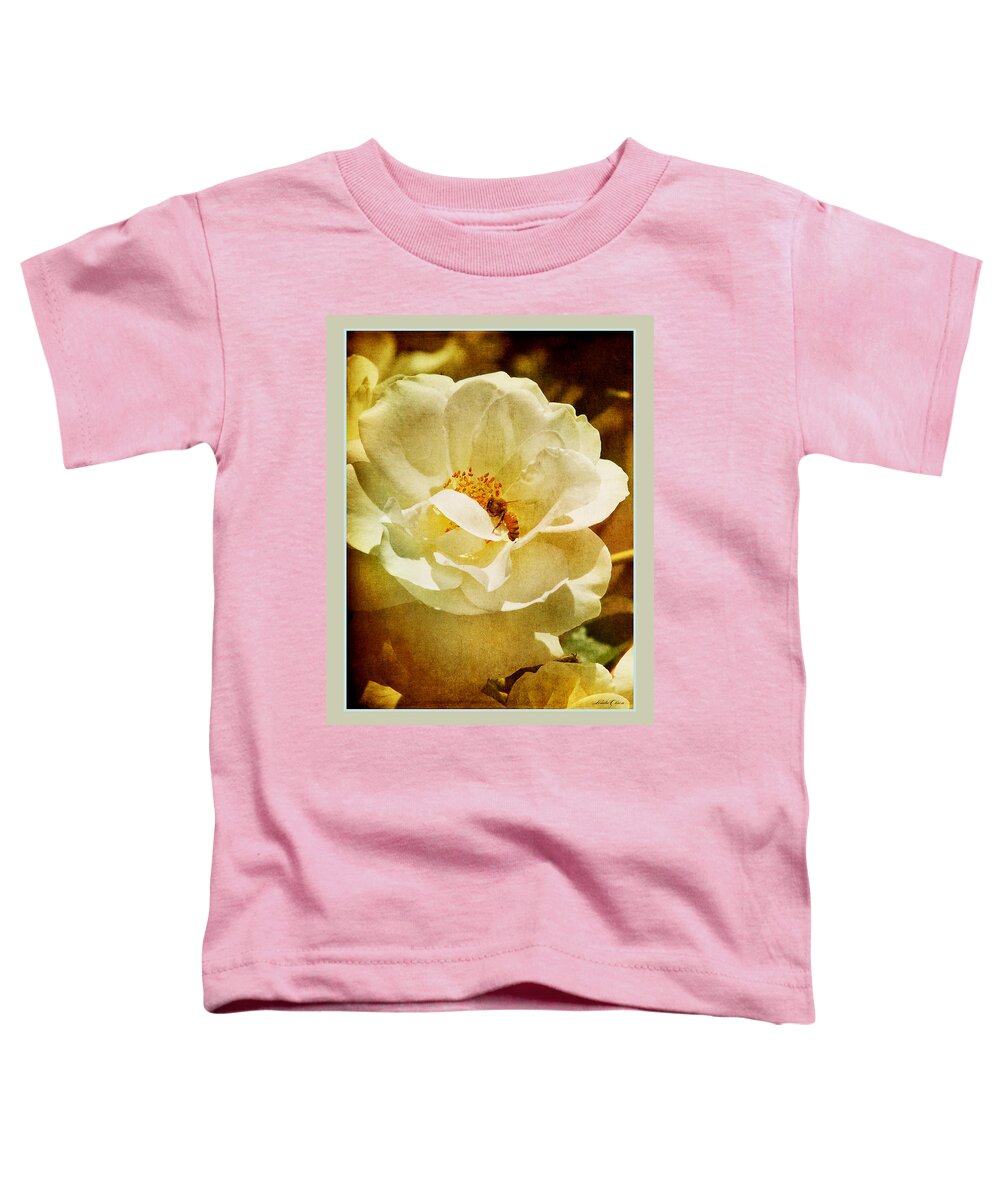 Garden Toddler T-Shirt featuring the photograph A Bee and Rose by Linda Olsen