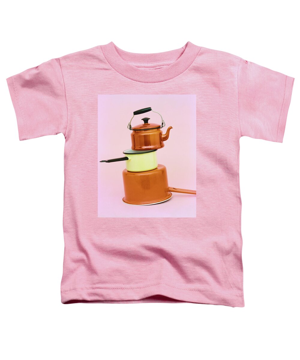 Utensils Toddler T-Shirt featuring the photograph A Brass Teapot Stocked On Top Of Pots by Richard Rutledge