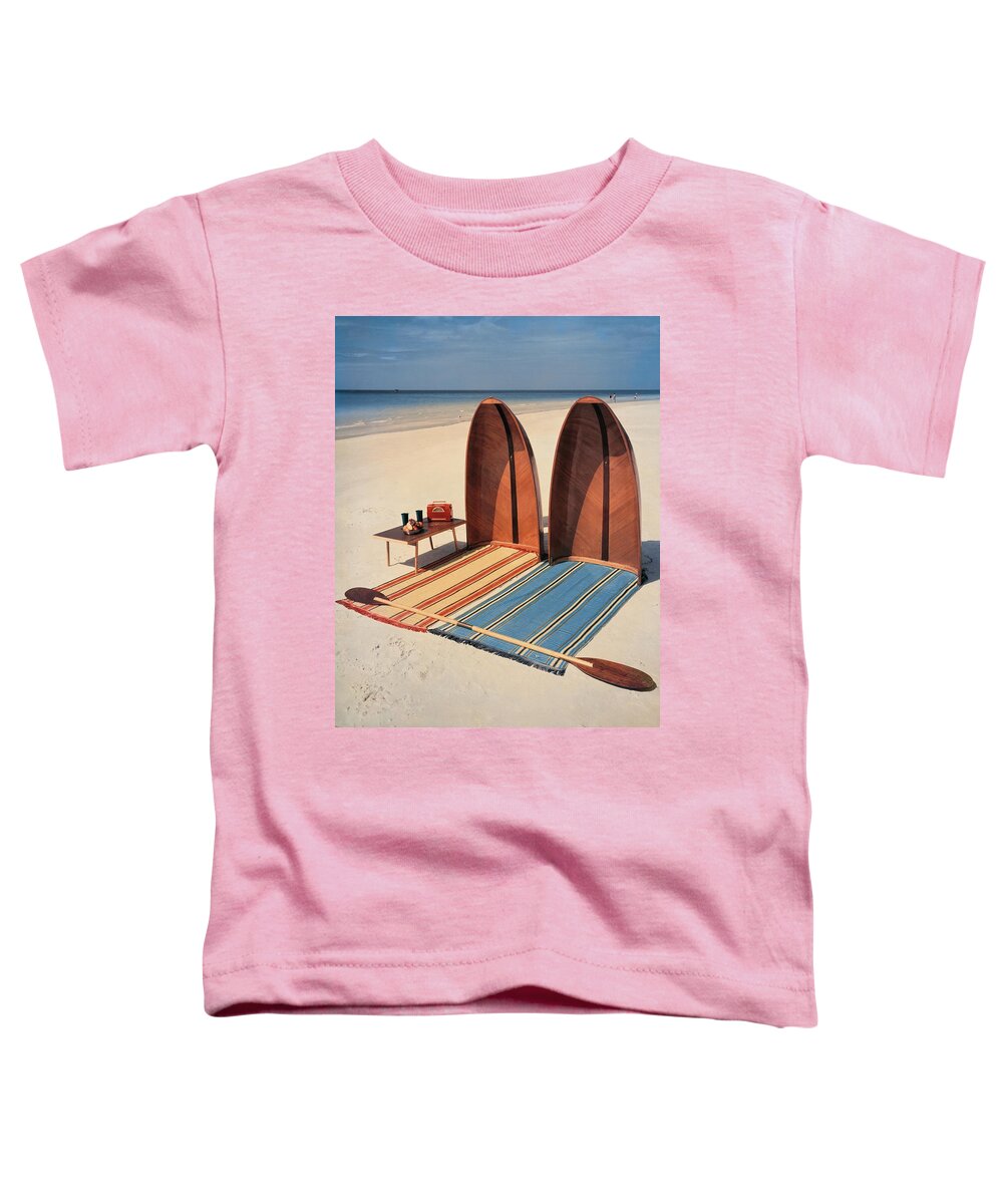 Accessories Toddler T-Shirt featuring the photograph Pixie Collapsible Boat On The Beach by Lois and Joe Steinmetz