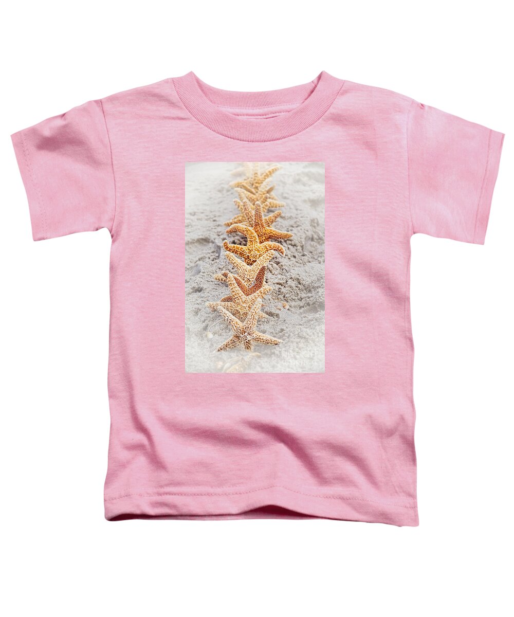 Starfish Toddler T-Shirt featuring the photograph The Starfish Line Dance by Debra Fedchin