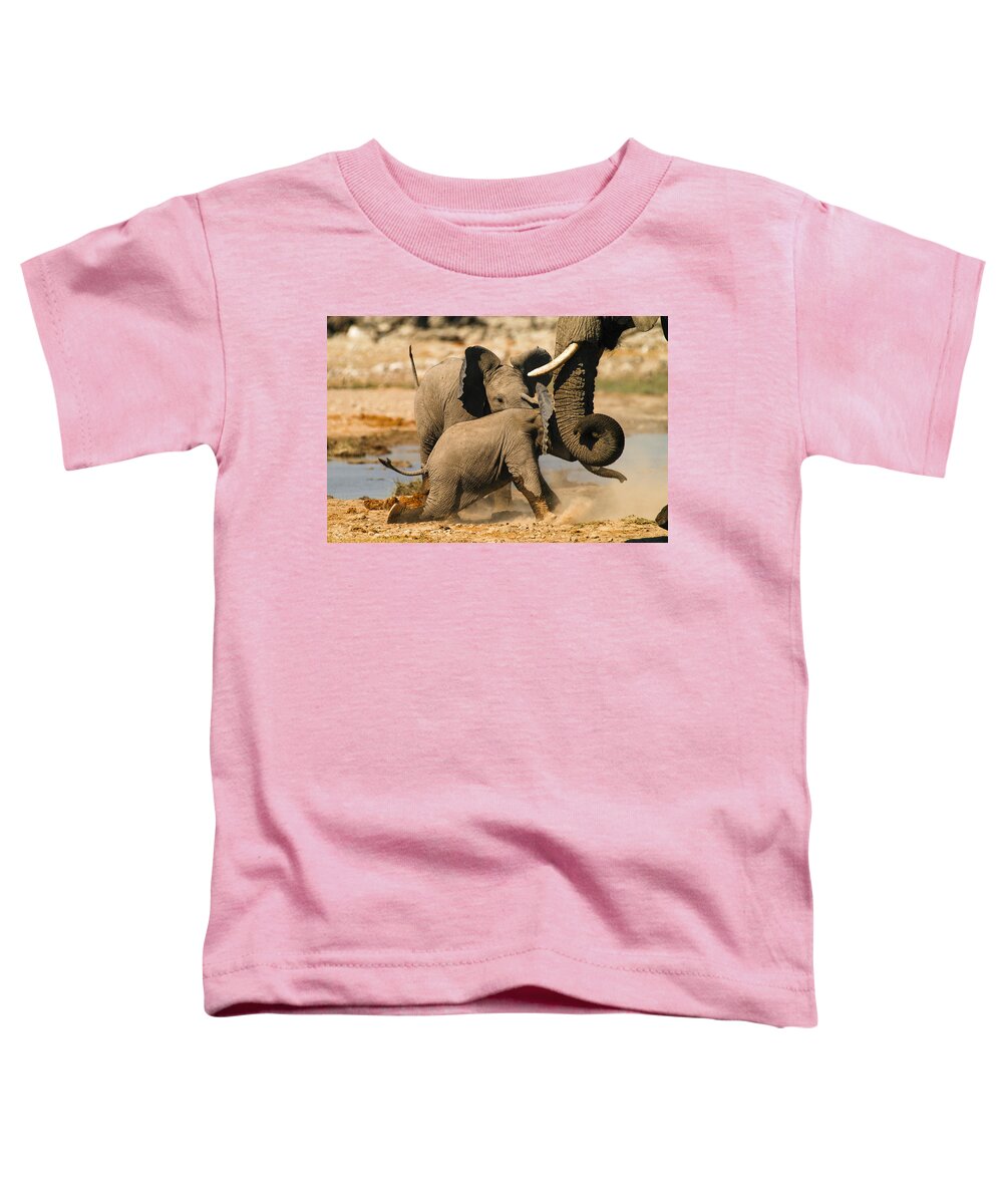 A Baby Elephants Play Toddler T-Shirt featuring the photograph Tough play 2 by Alistair Lyne