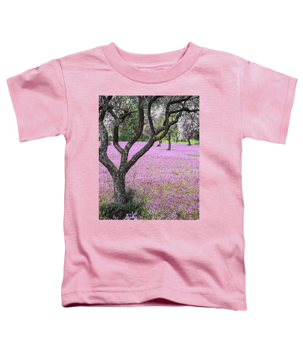 Spring Toddler T-Shirt featuring the photograph Spring landscape. Almond tree and purple flower field by Michalakis Ppalis