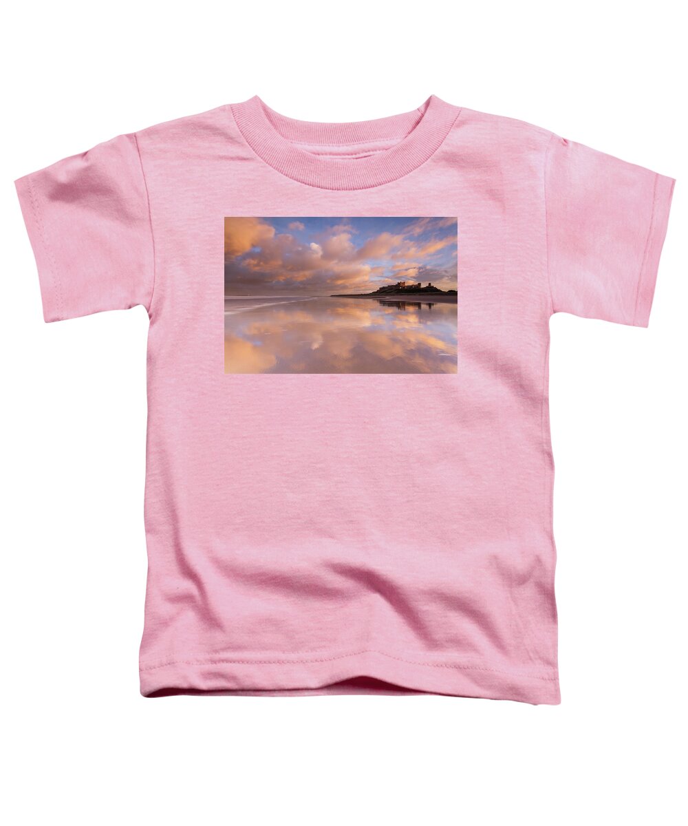 Bamburgh Castle Toddler T-Shirt featuring the photograph Bamburgh Castle sunset reflections on the beach by Anita Nicholson