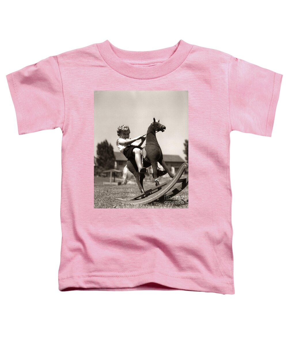 1930s Toddler T-Shirt featuring the photograph Boy On Rocking Horse, C.1930s by H. Armstrong Roberts/ClassicStock