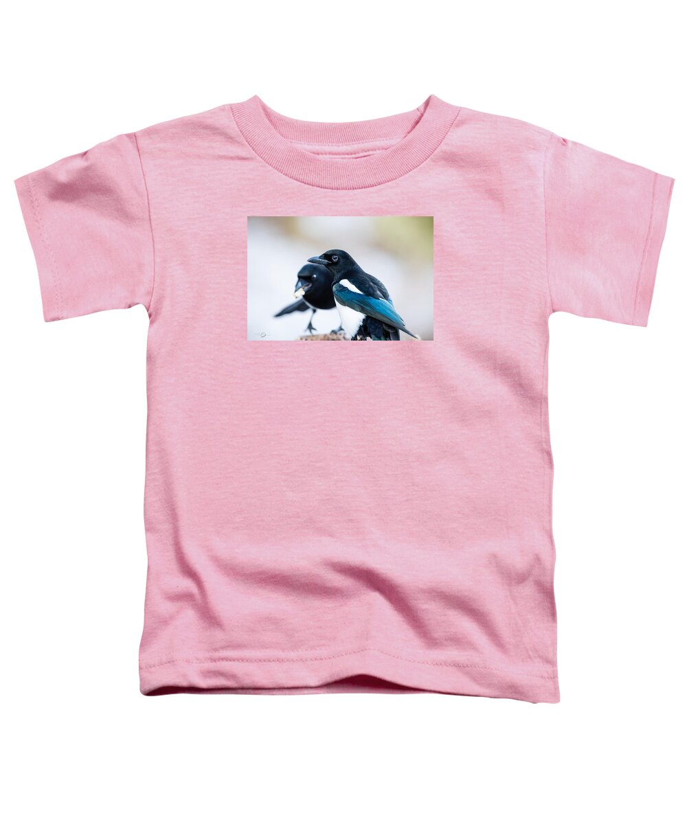 Pica Pica Toddler T-Shirt featuring the photograph Magpies and the peanuts by Torbjorn Swenelius