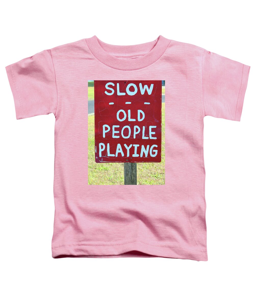 Men Toddler T-Shirt featuring the photograph Old People Playing by Cynthia Guinn