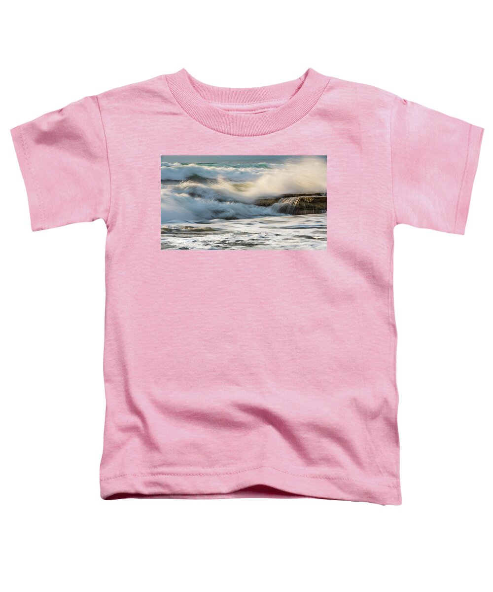 Sea Waves Toddler T-Shirt featuring the photograph Rocky seashore, wavy ocean and wind waves crashing on the rocks by Michalakis Ppalis