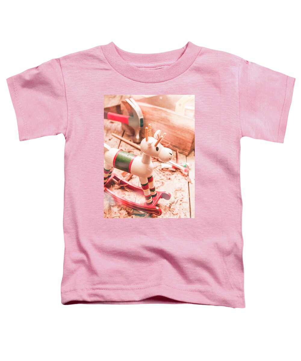 Christmas Toddler T-Shirt featuring the photograph Small Xmas Reindeer On Wood Shavings In Workshop by Jorgo Photography