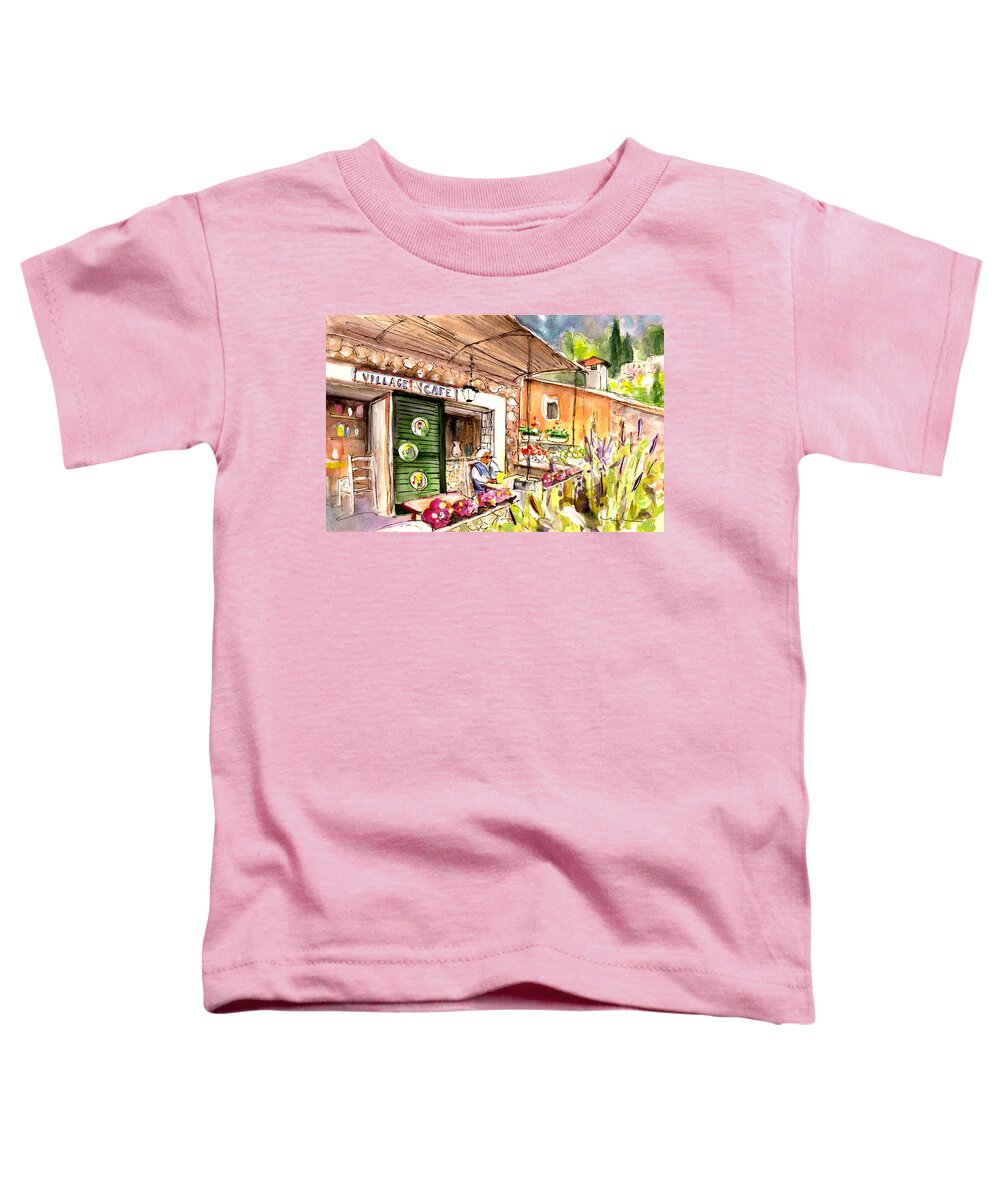 Travel Toddler T-Shirt featuring the painting The Village Cafe In Deia by Miki De Goodaboom