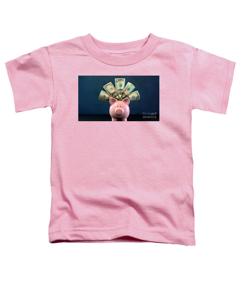 401k Toddler T-Shirt featuring the photograph Pink Piggy bank money concept on dark blue background #1 by Milleflore Images