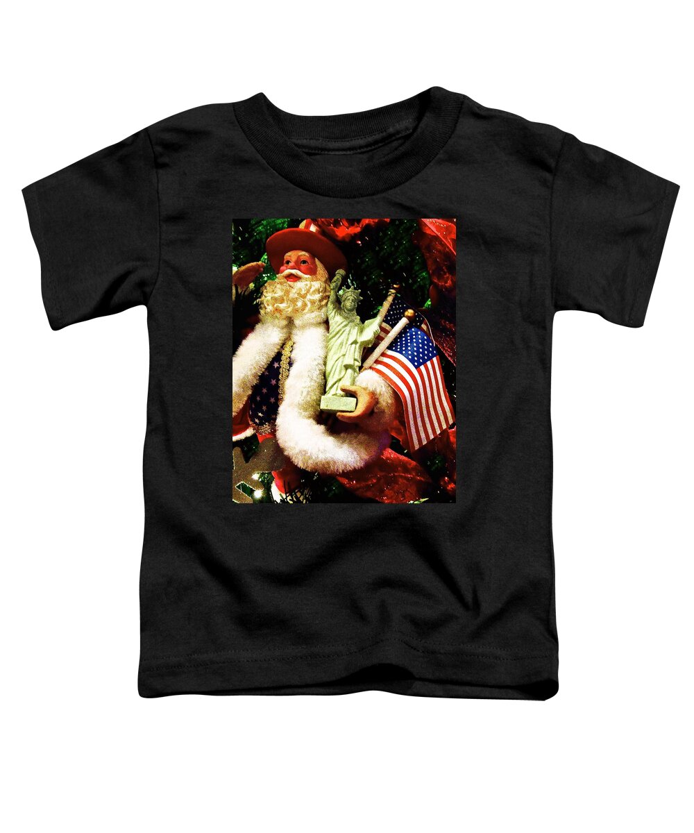 Santa Holding American Flag Toddler T-Shirt featuring the photograph Patriotic Santa by Joan Reese