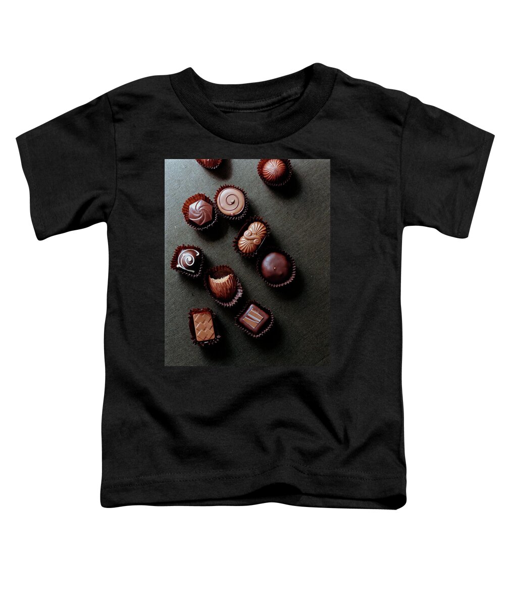 Cooking Toddler T-Shirt featuring the photograph A Selection Of Chocolates by Romulo Yanes