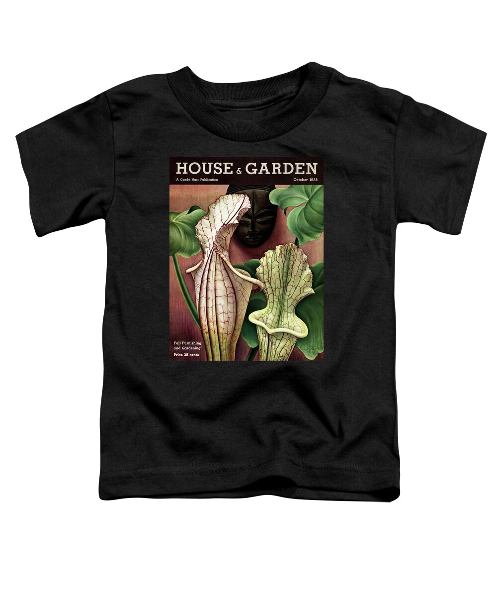 Photograph Toddler T-Shirt featuring the photograph A Tropical Flower And An African Mask by Edna Reindel