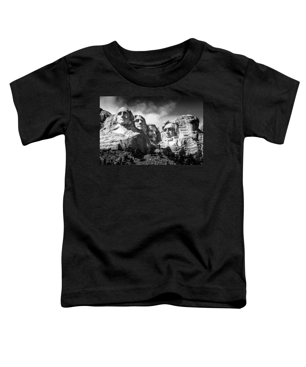 Mount Rushmore National Memorial In Black & White. Mount Rushmore Toddler T-Shirt featuring the photograph Mount Rushmore National Memorial in Black and White by Debra Martz