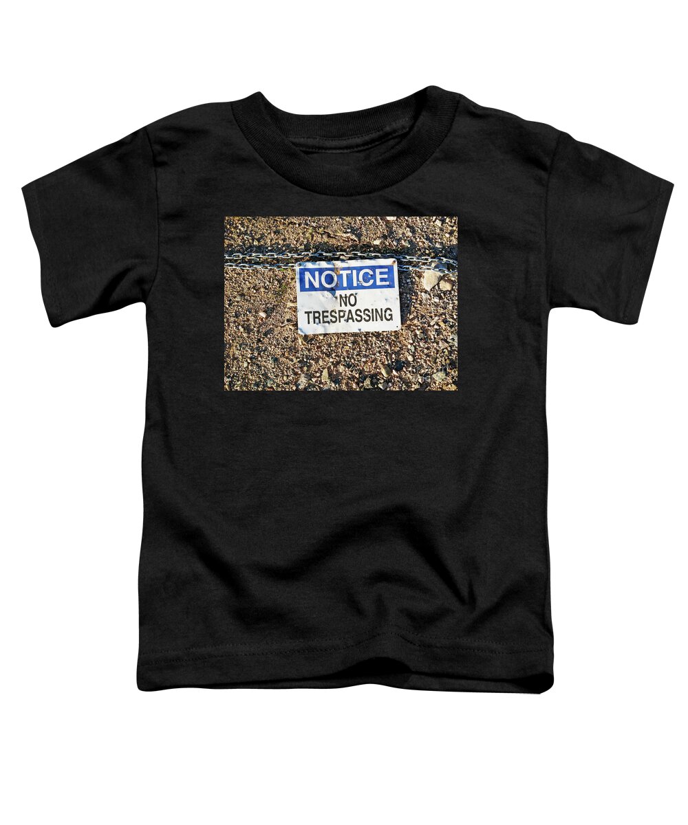 Access Toddler T-Shirt featuring the photograph No Trespassing Sign on Ground by Bryan Mullennix