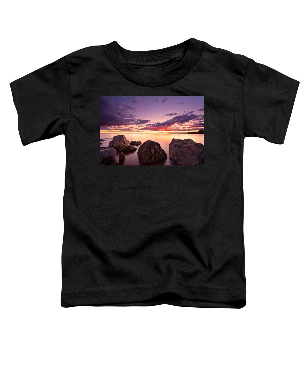 Beach Toddler T-Shirt featuring the photograph Sea at sunset the sky is in beautiful dramatic color by U Schade
