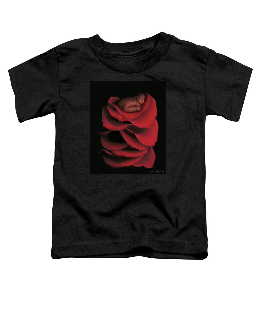 Rose Toddler T-Shirt featuring the photograph Kwasi On A Bed Of Rose Petals by Anne Geddes