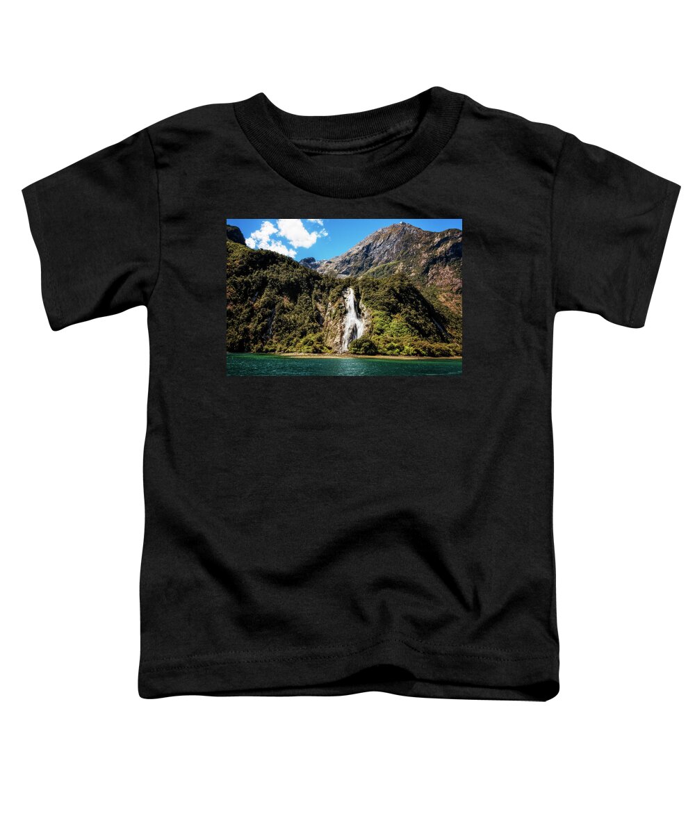 Joan Carroll Toddler T-Shirt featuring the photograph Bowen Falls Milford Sound New Zealand by Joan Carroll