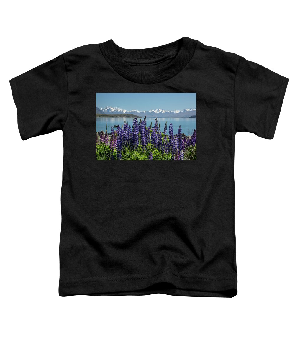 New Zealand Toddler T-Shirt featuring the photograph Lupines at Lake Tekapo by Cheryl Strahl