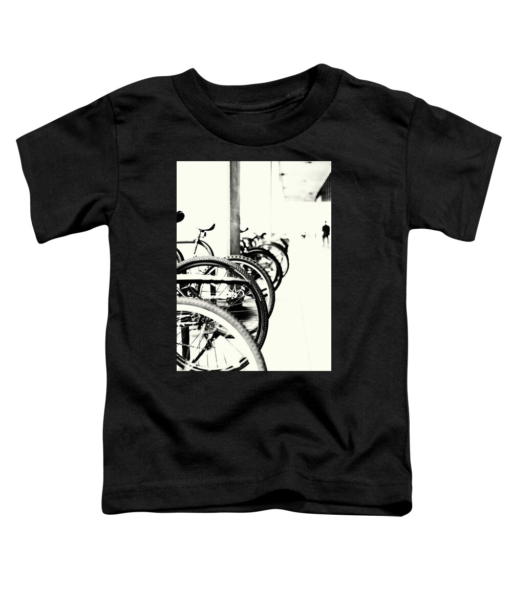 Commuter Bikes Toddler T-Shirt featuring the photograph Passing Cycles by John Williams