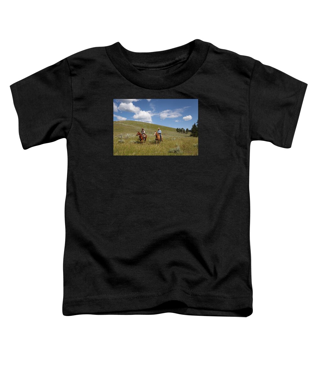 Cowboys Toddler T-Shirt featuring the photograph Riding Fences by Diane Bohna