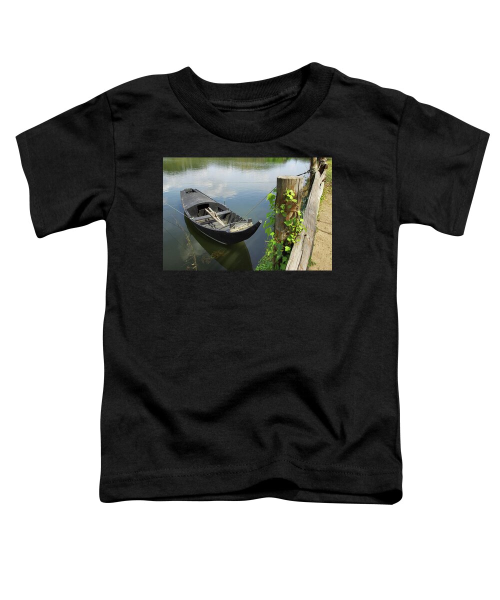 Boat Toddler T-Shirt featuring the photograph Row Boat on the shoreline by Carlos Caetano