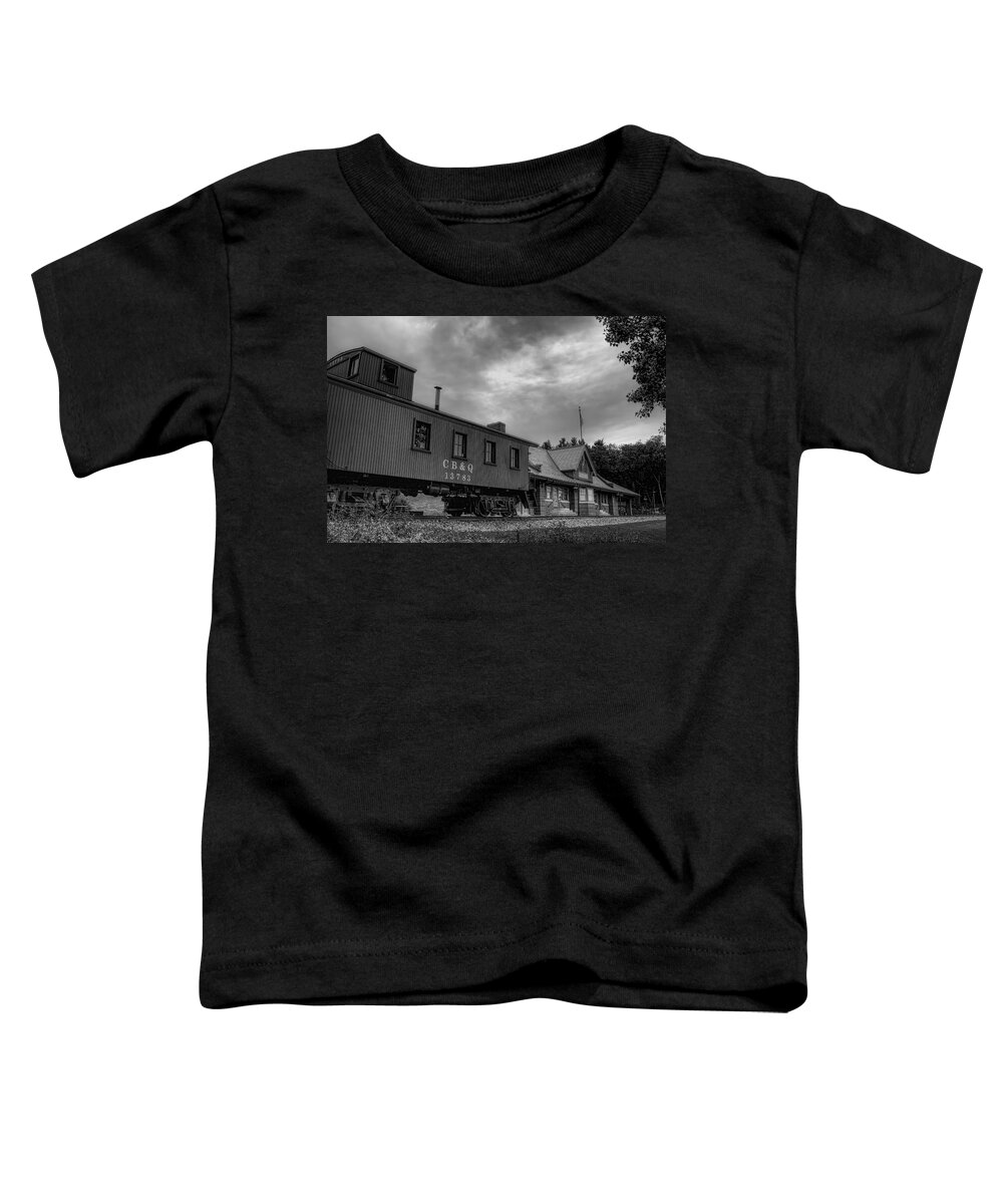 Railroad Toddler T-Shirt featuring the photograph The Depot Under Cloudy Skies Black and White by Dale Kauzlaric